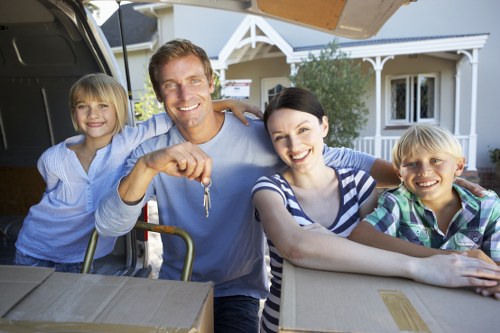 Professional house removalists loading items carefully in North London