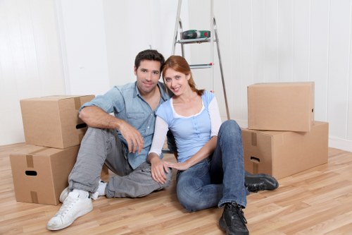 Loading furniture into a moving truck for a Wood Green property