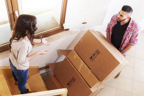 Packed boxes and furniture ready for transport in a Wood Green home