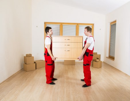 Careful loading of furniture into a moving van in Wood Green
