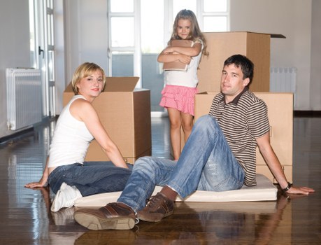 Business furniture and equipment being prepared for a local move