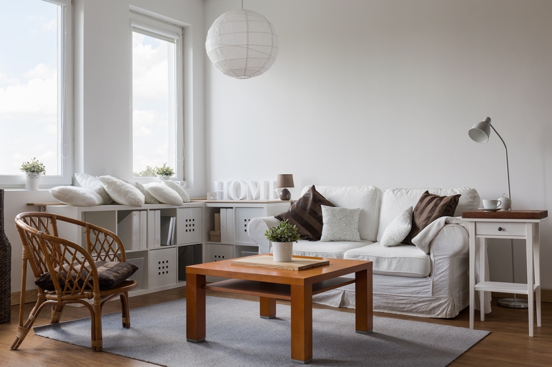 Movers carrying furniture through a residential property in Wood Green